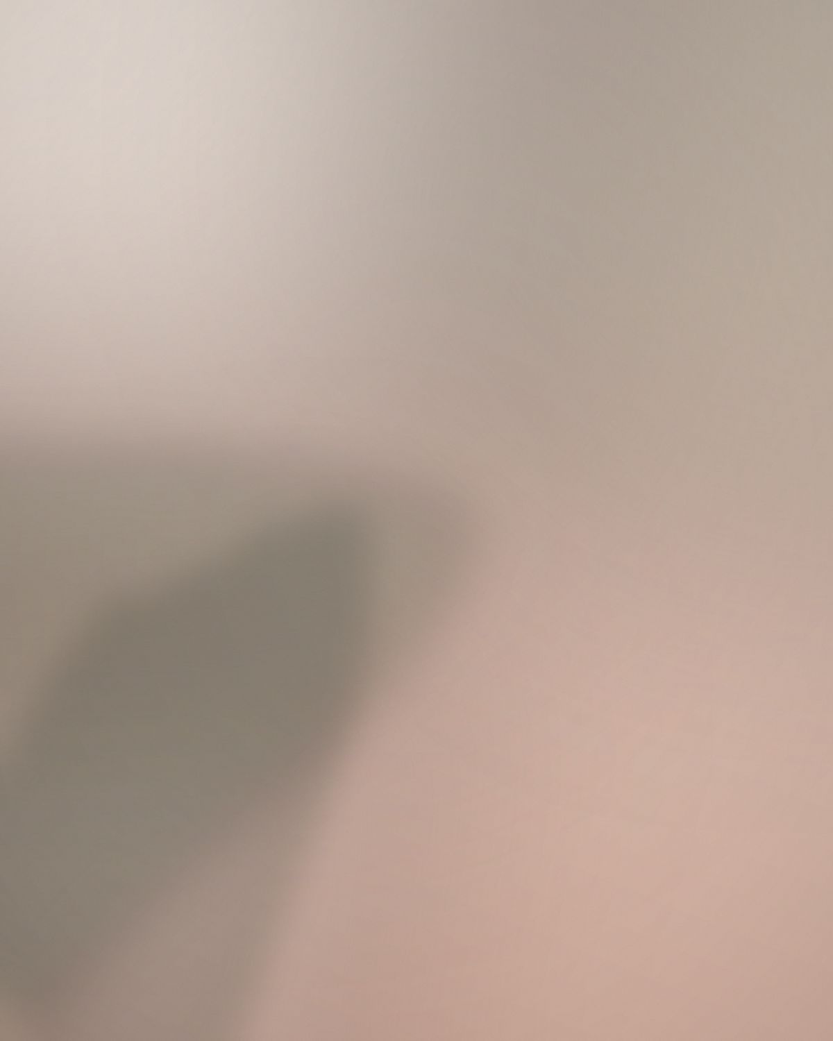 Hands applying serum in soft daylight